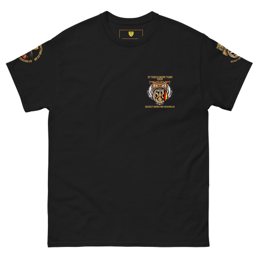 A black short-sleeve crewneck t-shirt with a detailed 51 Desert patch tiger graphic on the left chest and gold military-style patches on both sleeves, displayed on a solid white background.